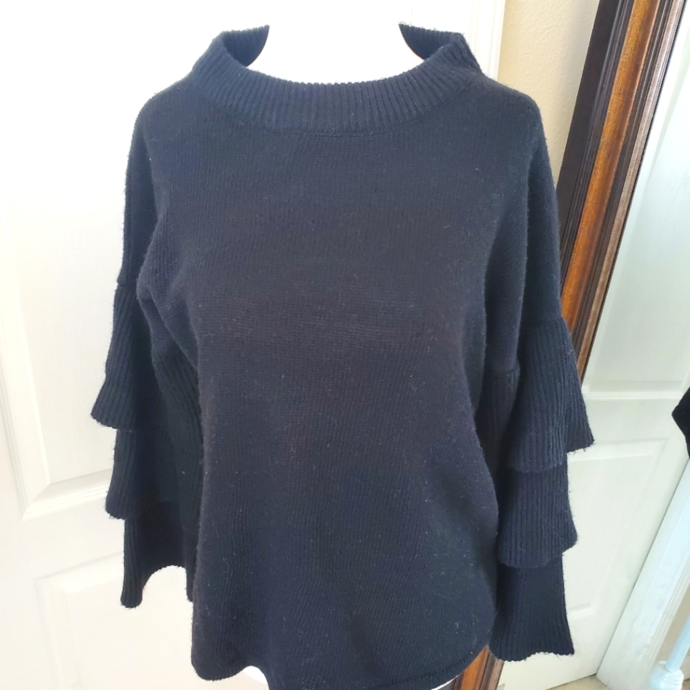Black ruffle sleeve layered knit sweater. Great to pair with skirts and pants